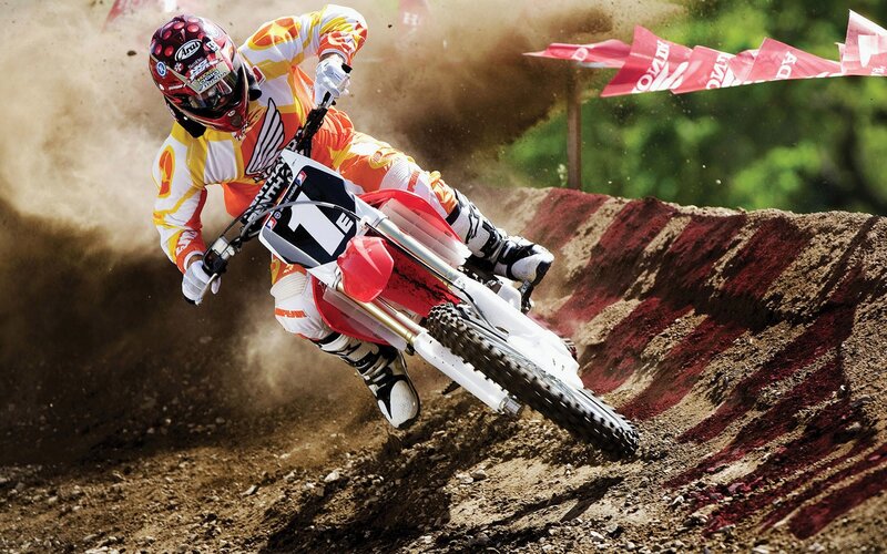 Motocross rider on dirt track