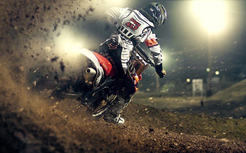 Motocross rider on dirt track