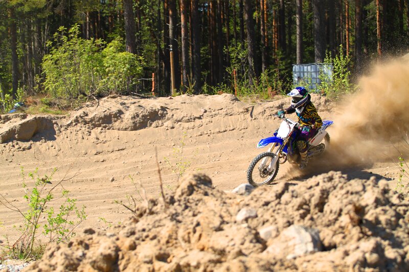 Motocross rider on dirt track
