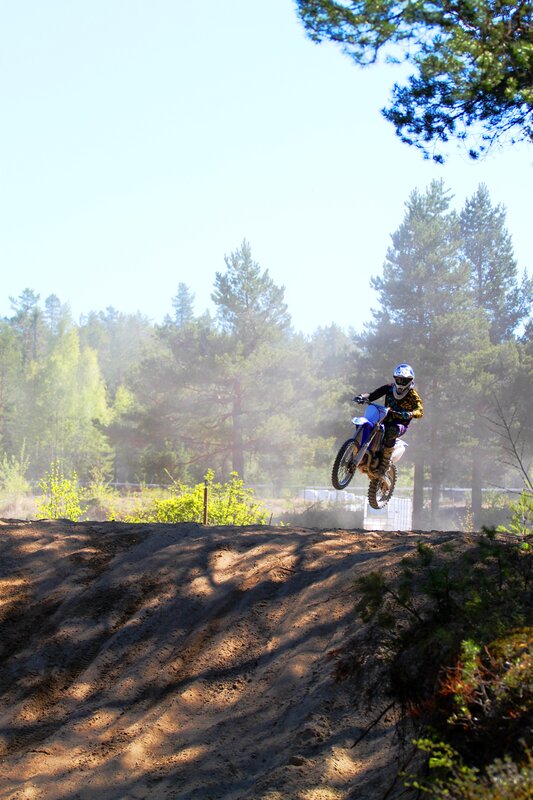 Motocross rider on dirt track