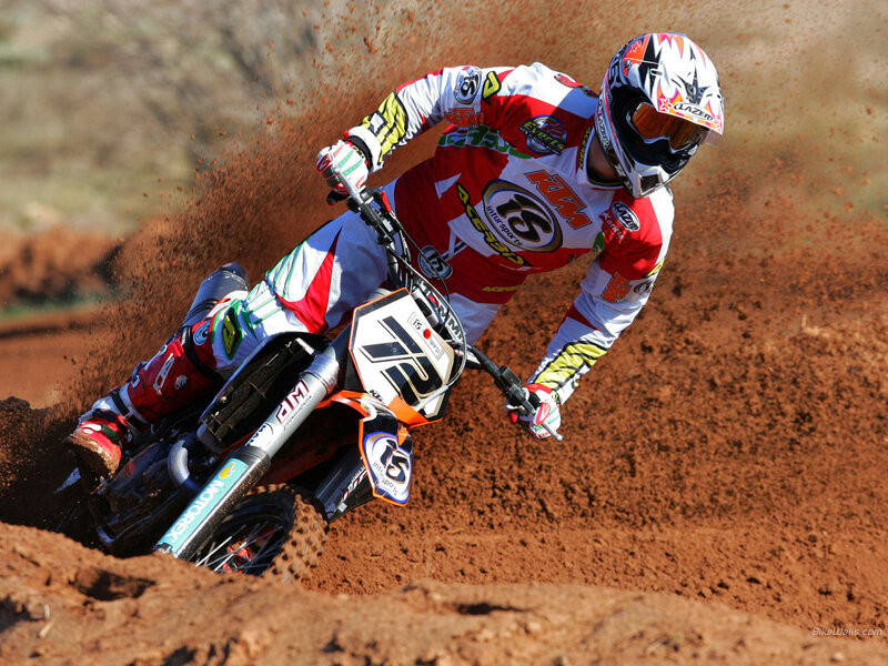 Motocross rider on dirt track