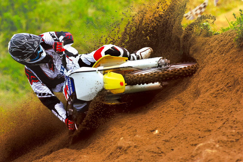 Motocross rider on dirt track