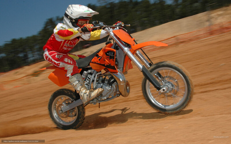 Motocross rider on dirt track