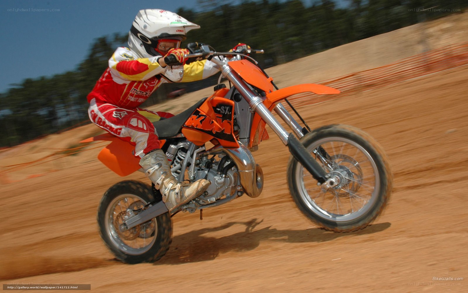 Motocross rider on dirt track