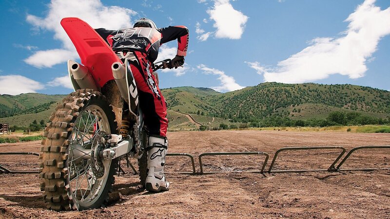 Motocross rider on dirt track