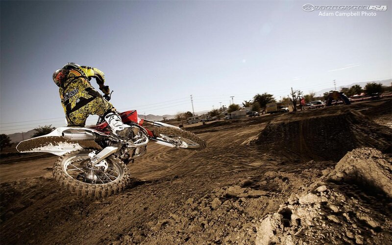 Motocross rider on dirt track