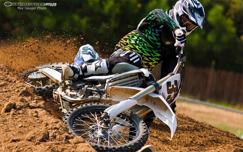 Motocross rider on dirt track