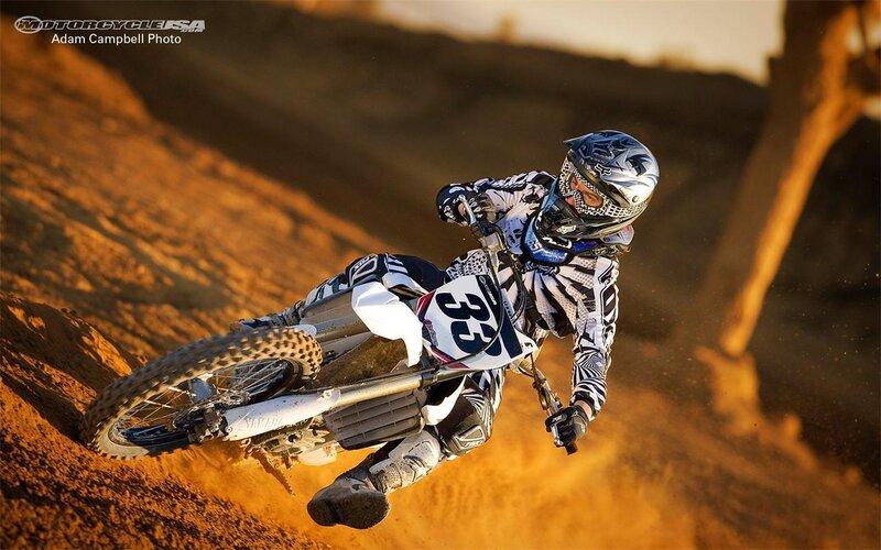 Motocross rider on dirt track