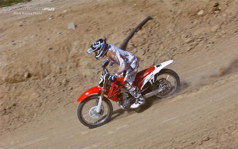 Motocross rider on dirt track
