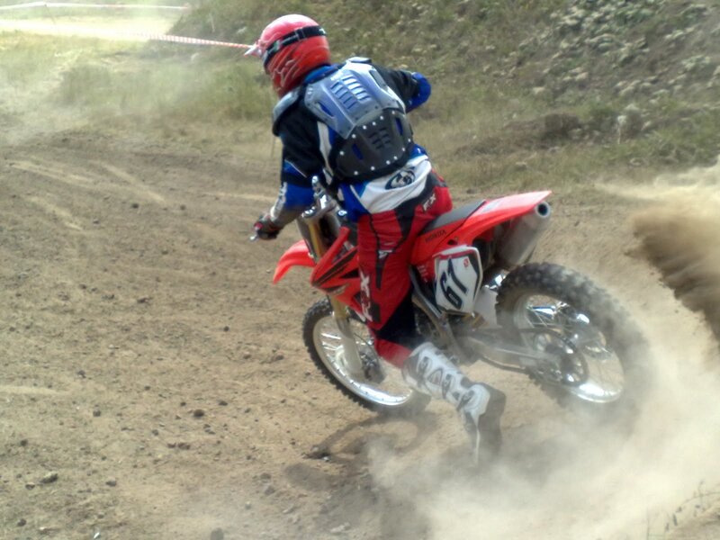 Motocross rider on dirt track