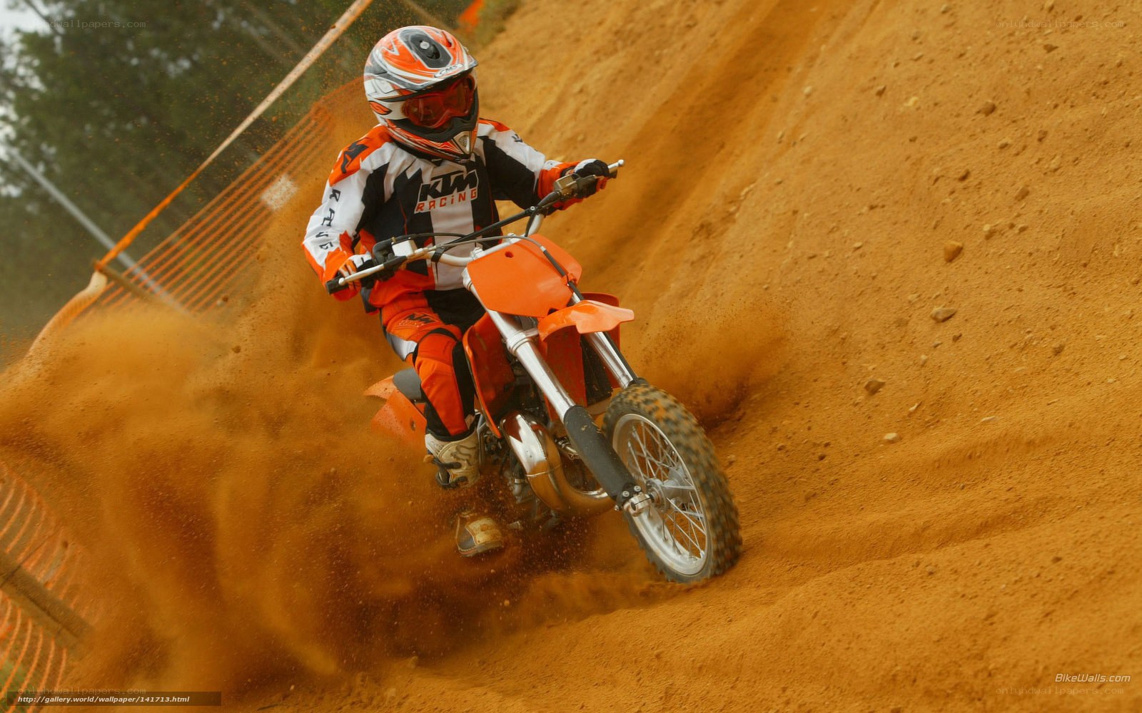 Motocross rider on dirt track