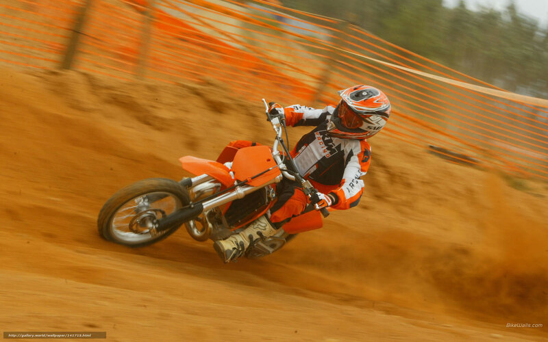 Motocross rider on dirt track
