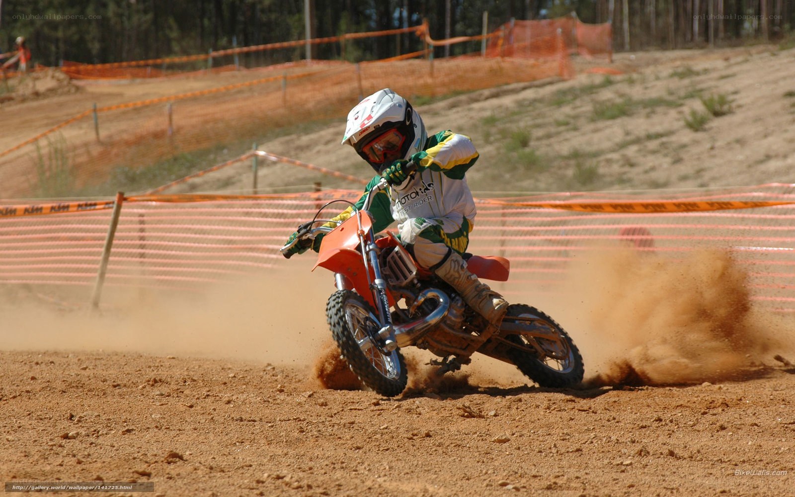 Motocross rider on dirt track