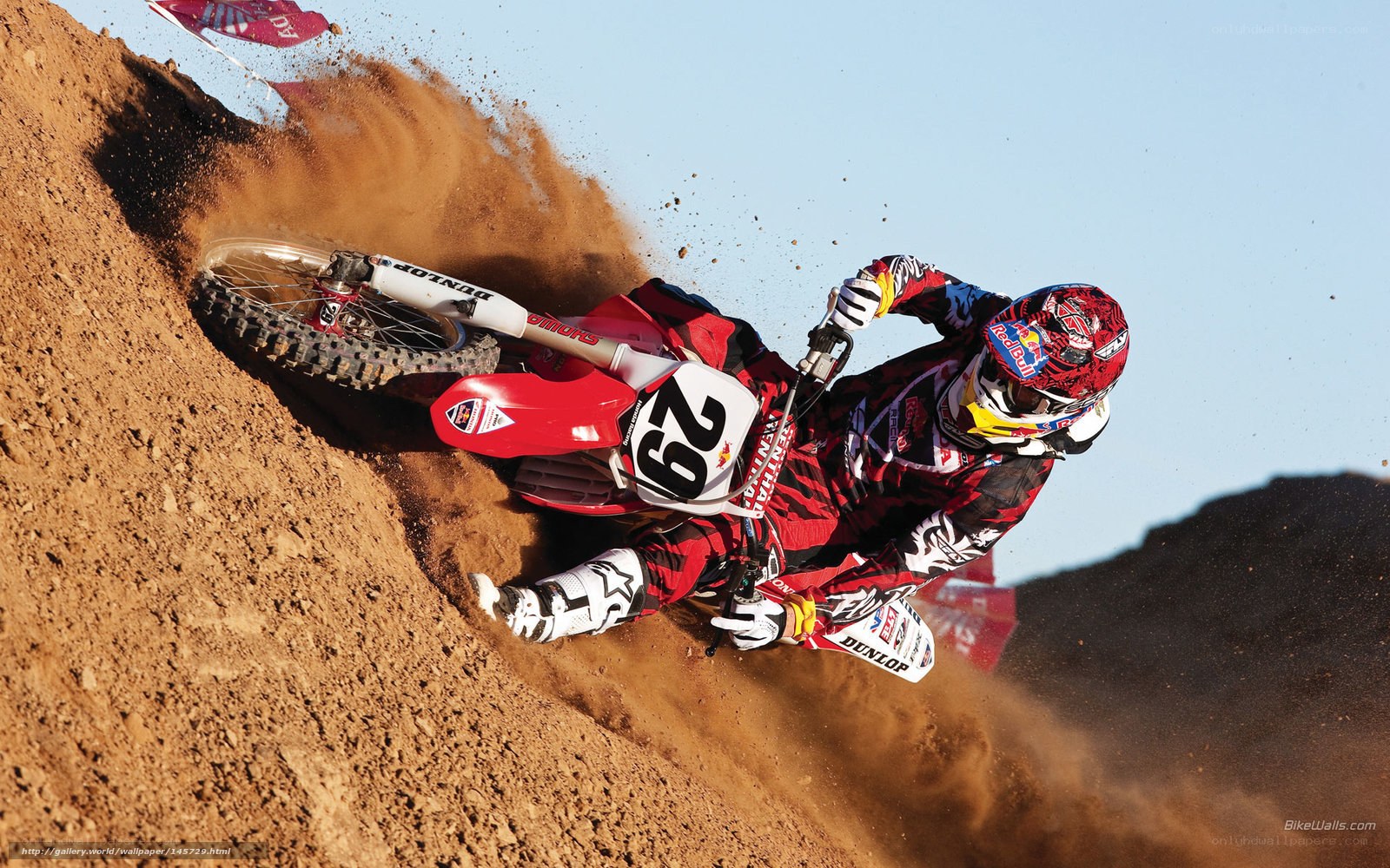 Motocross rider on dirt track