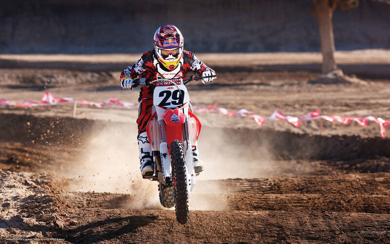 Motocross rider on dirt track