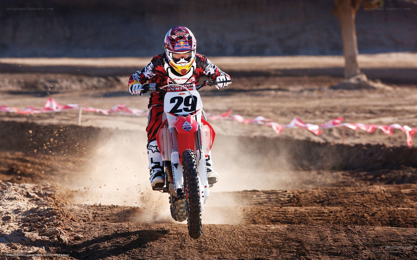 Motocross rider on dirt track