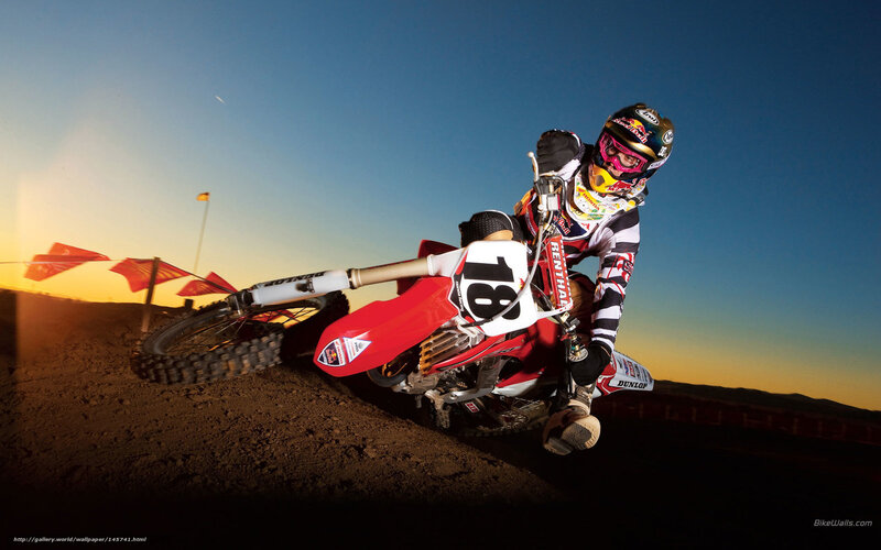Motocross rider on dirt track