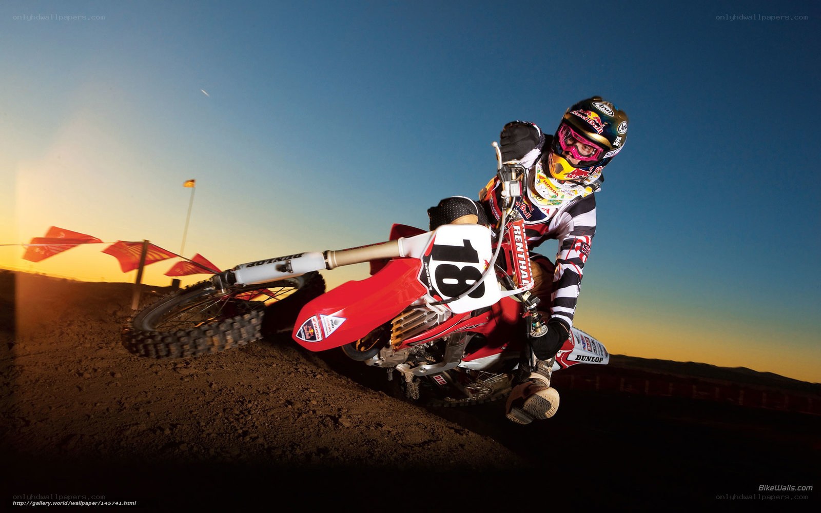 Motocross rider on dirt track