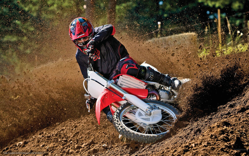 Motocross rider on dirt track