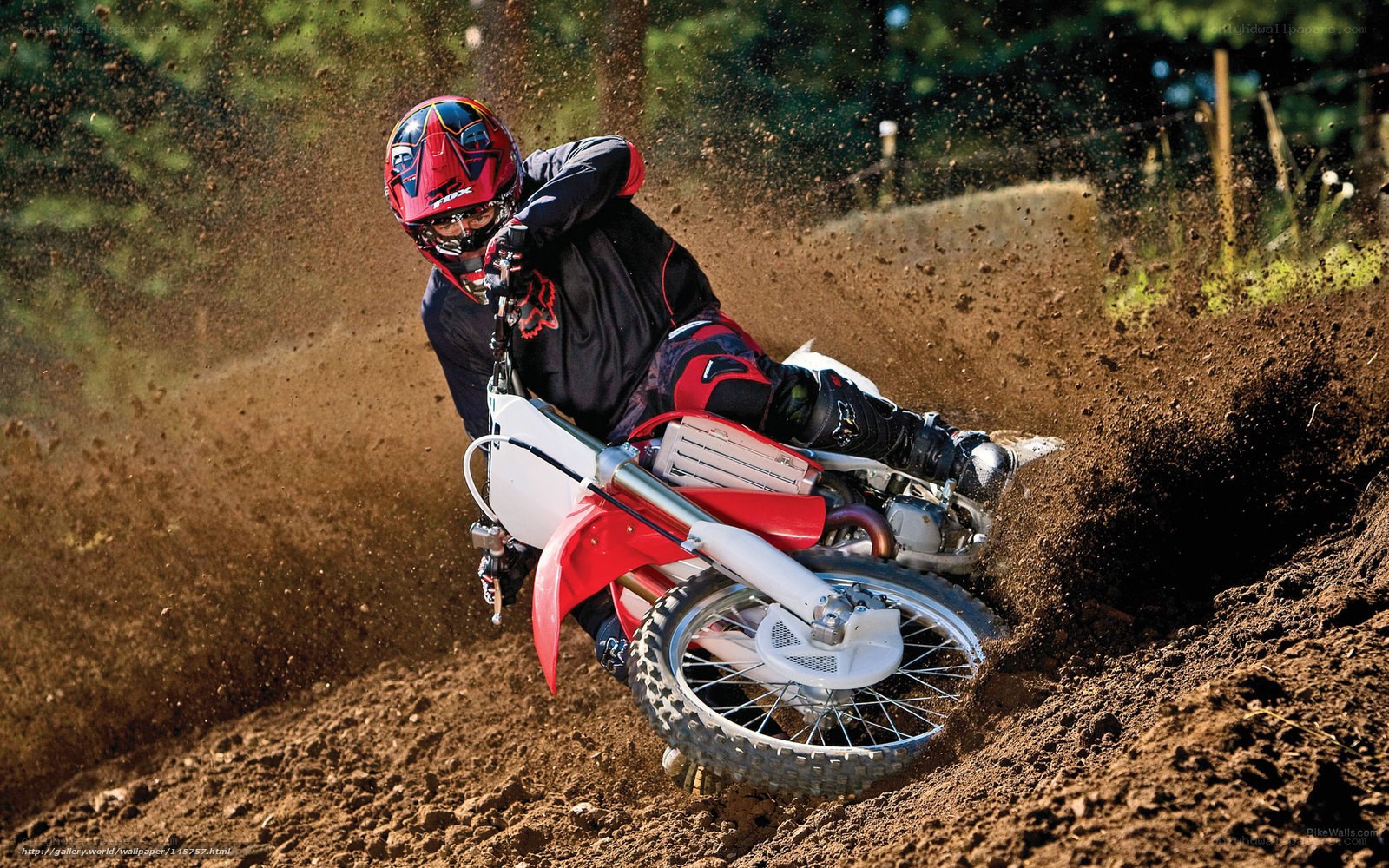 Motocross rider on dirt track