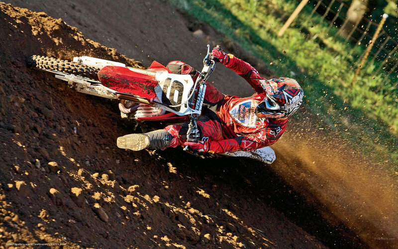 Motocross rider on dirt track