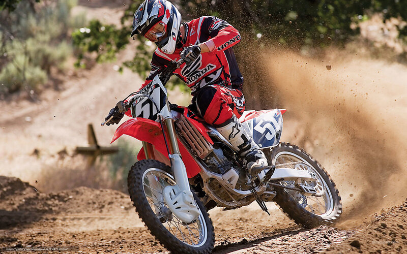 Motocross rider on dirt track