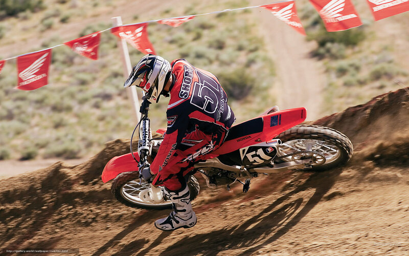 Motocross rider on dirt track