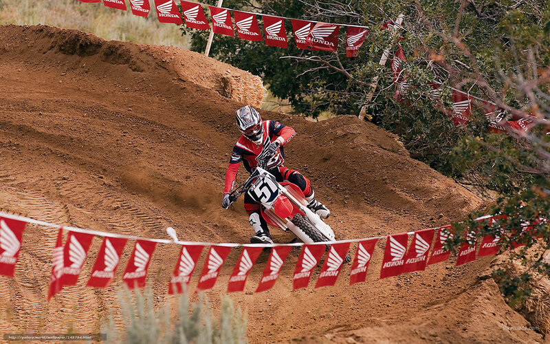 Motocross rider on dirt track