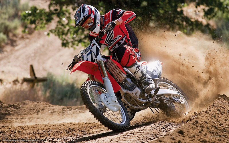 Motocross rider on dirt track