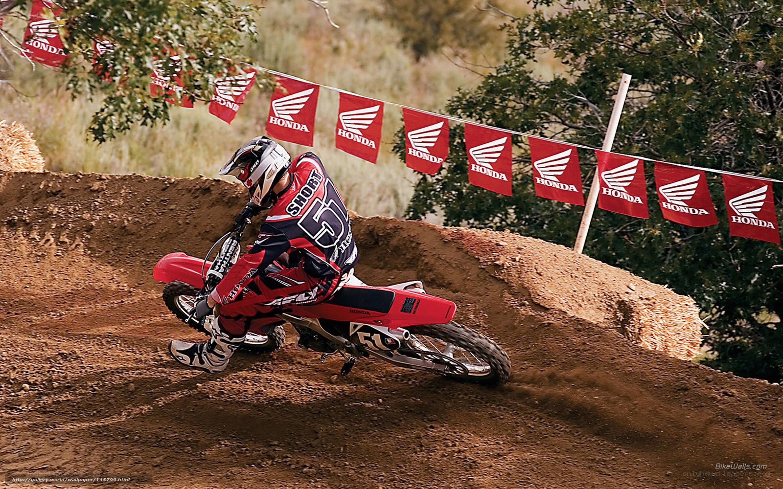 Motocross rider on dirt track