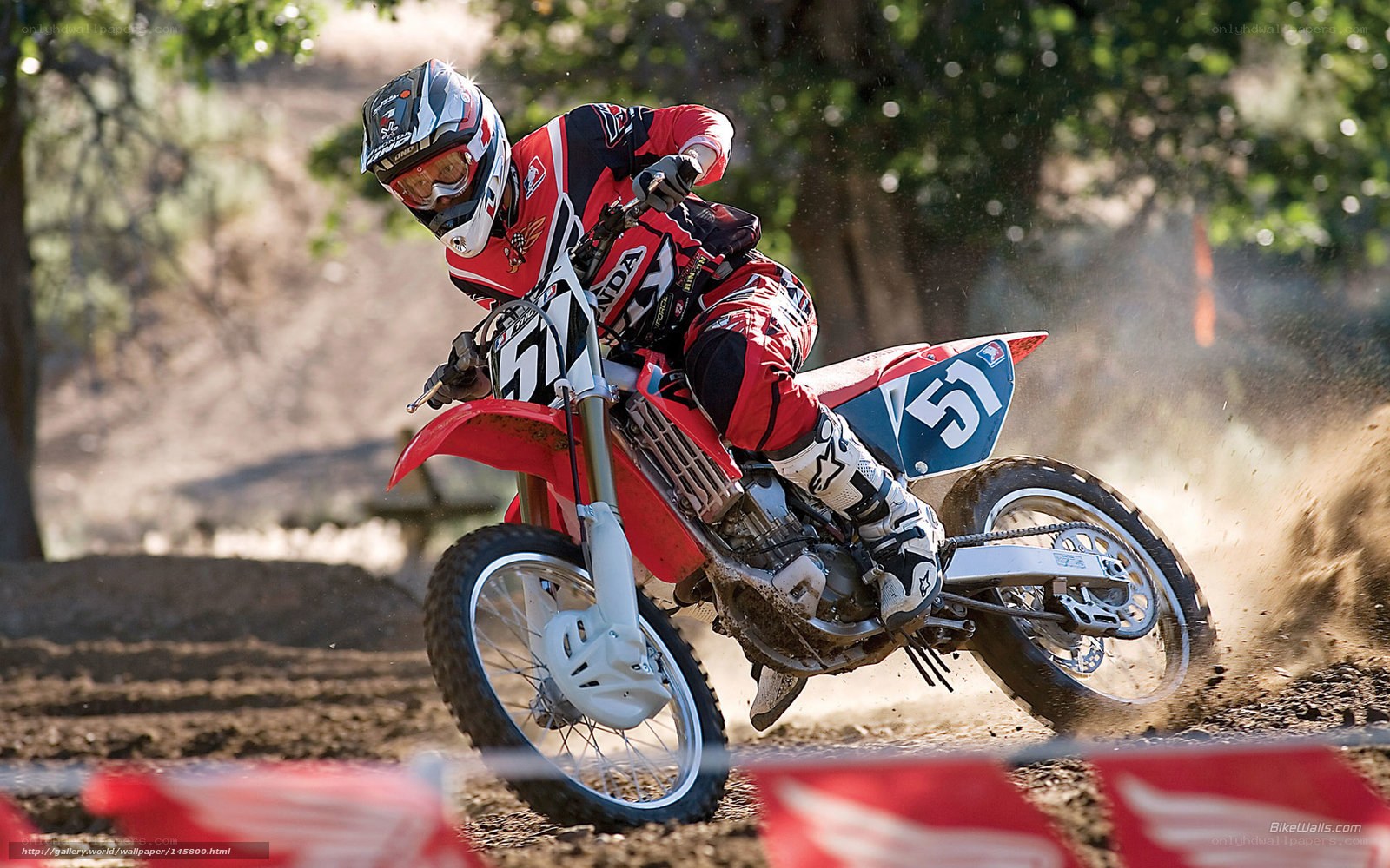 Motocross rider on dirt track