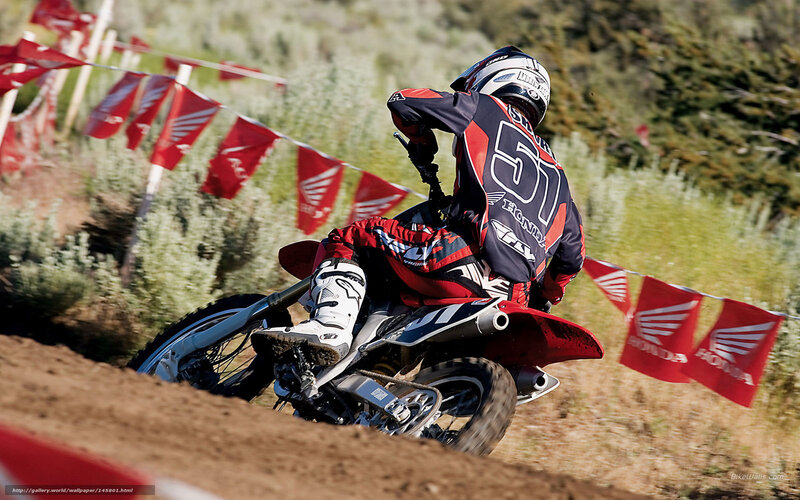 Motocross rider on dirt track