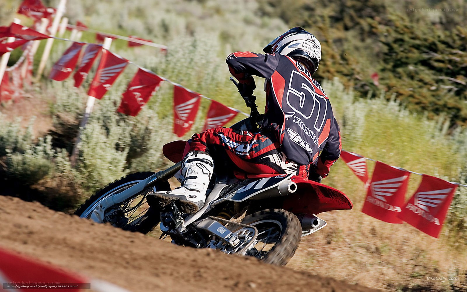 Motocross rider on dirt track