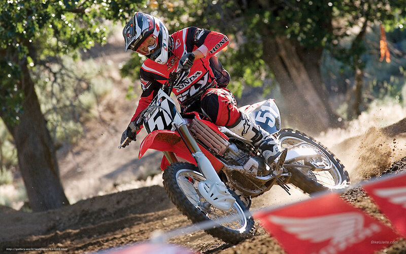 Motocross rider on dirt track