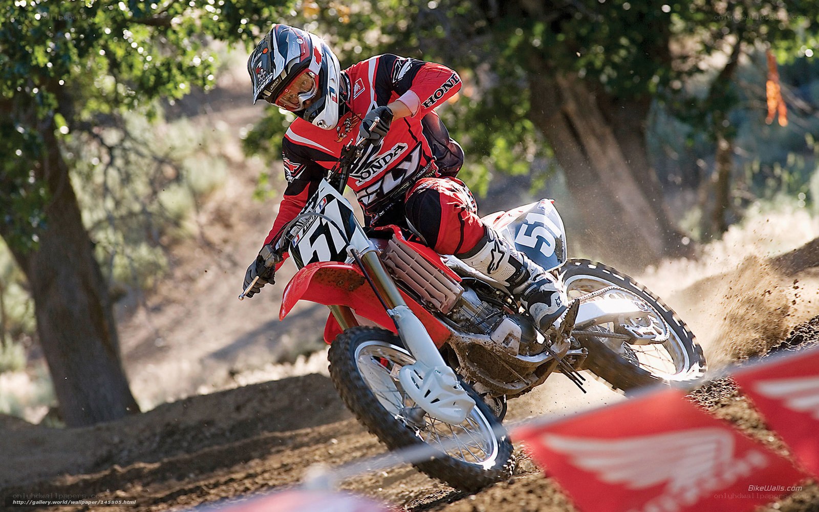 Motocross rider on dirt track