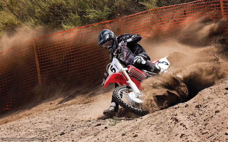 Motocross rider on dirt track