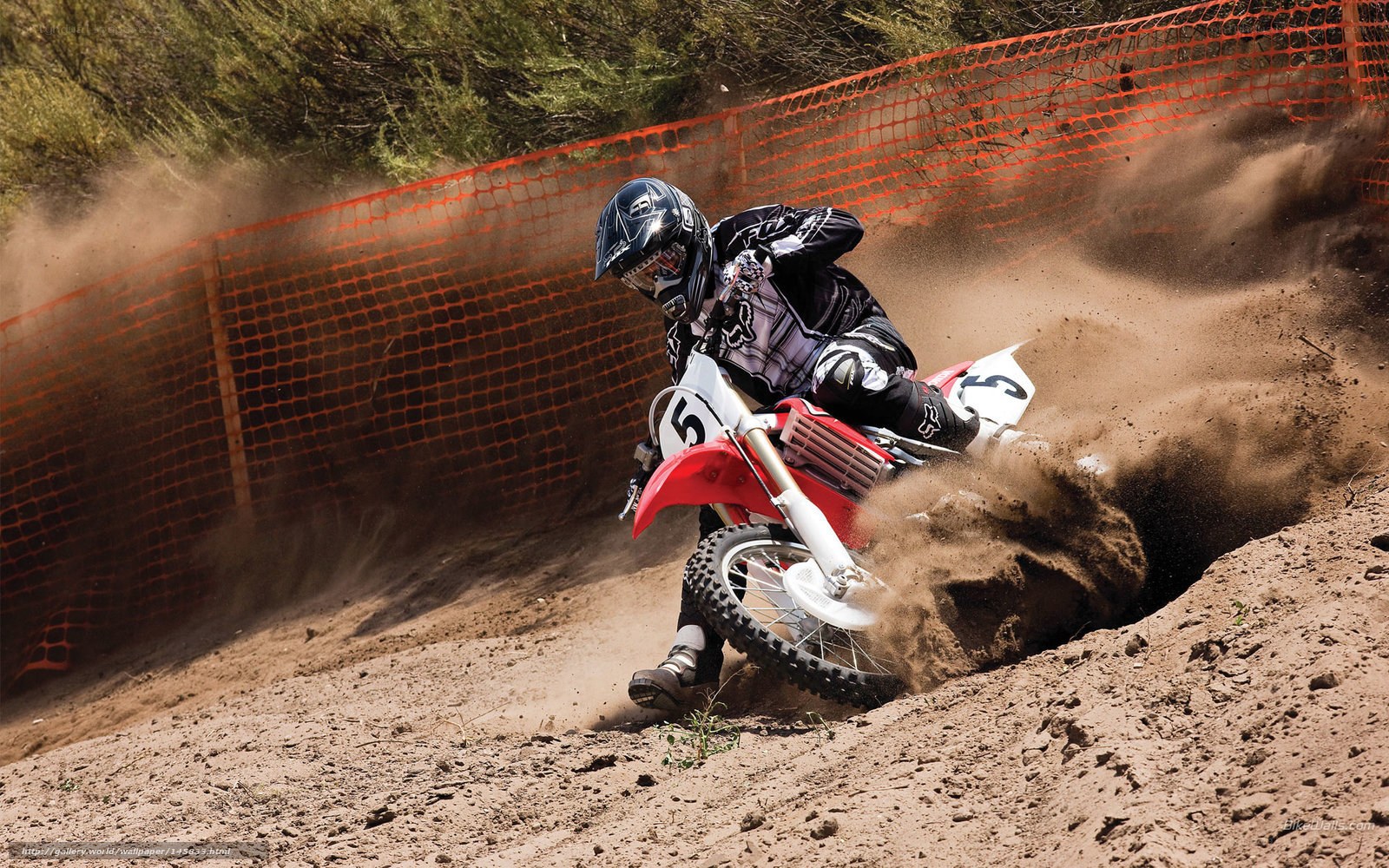 Motocross rider on dirt track
