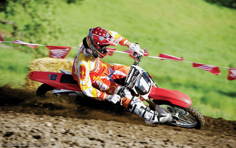 Motocross rider on dirt track