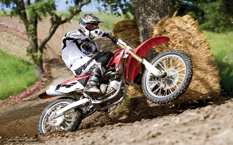 Motocross rider on dirt track