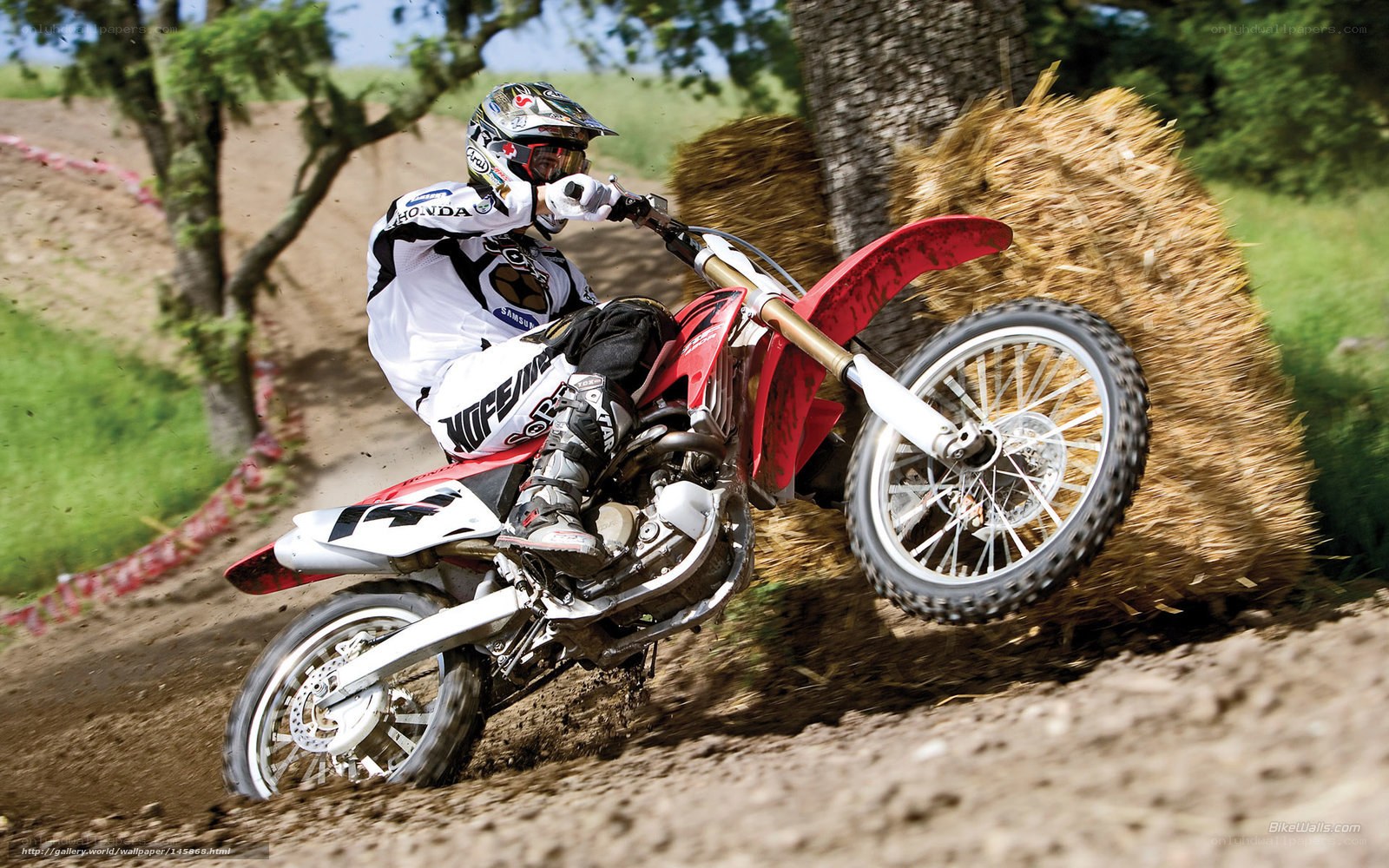 Motocross rider on dirt track