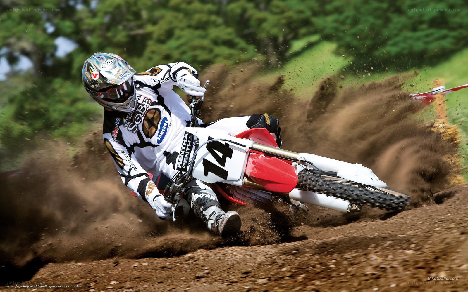 Motocross rider on dirt track