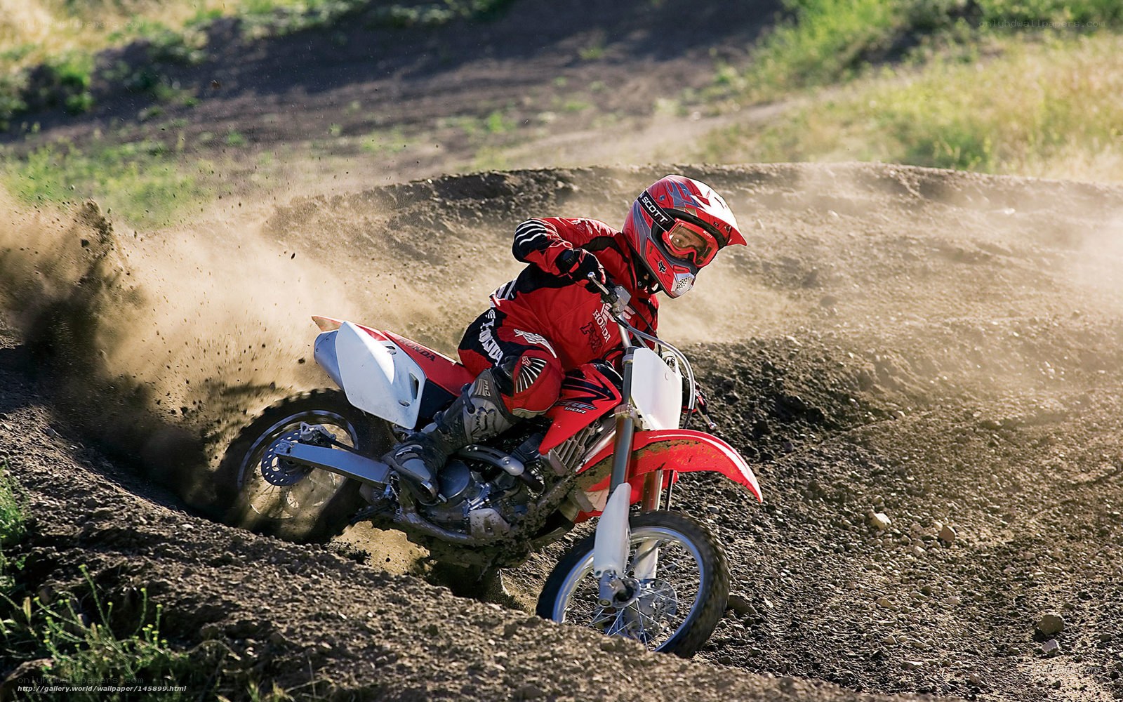 Motocross rider on dirt track