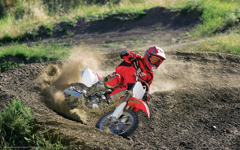 Motocross rider on dirt track