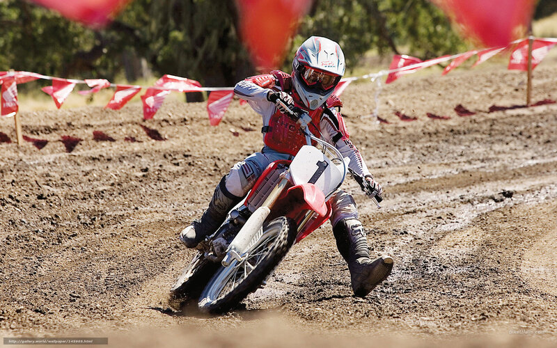 Motocross rider on dirt track