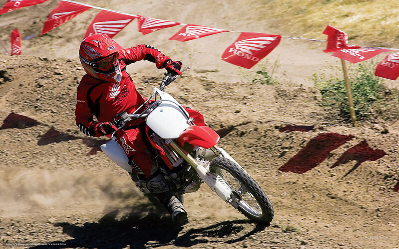 Motocross rider on dirt track