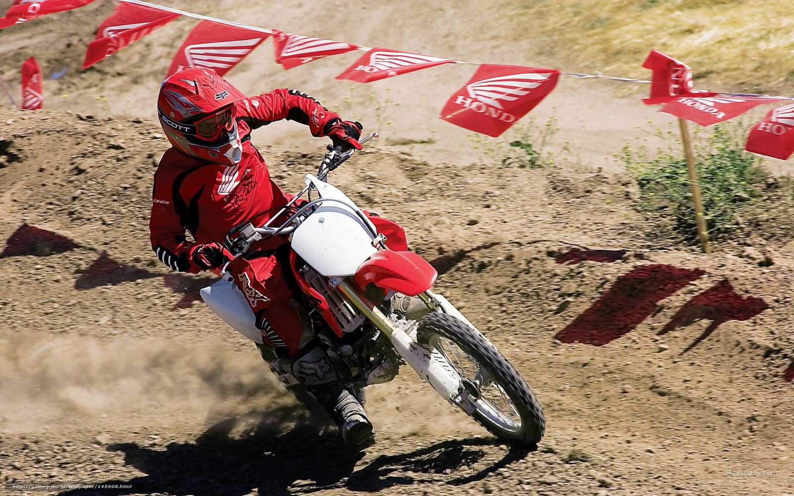 Motocross rider on dirt track