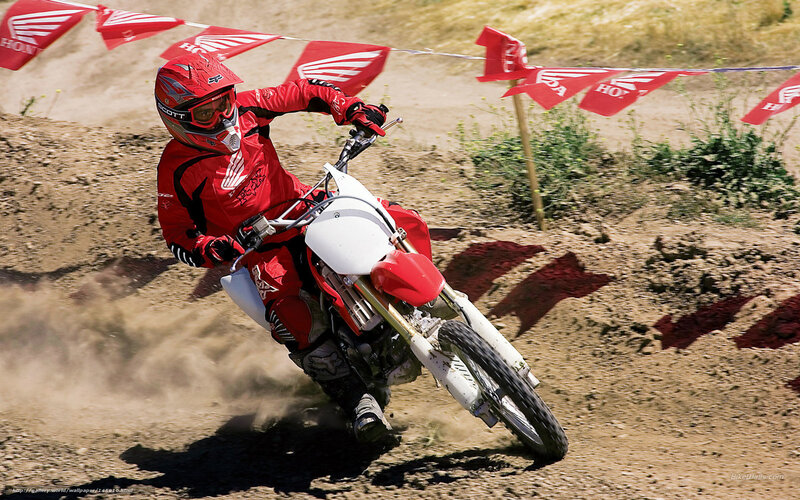Motocross rider on dirt track