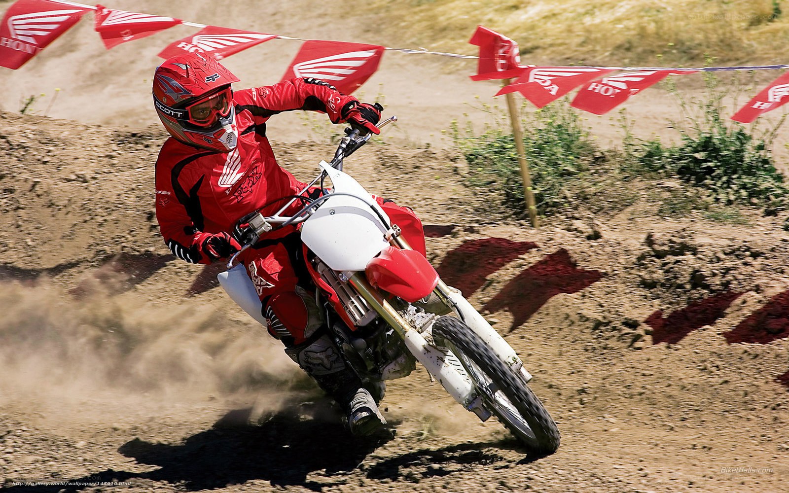 Motocross rider on dirt track