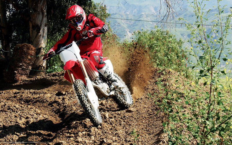 Motocross rider on dirt track