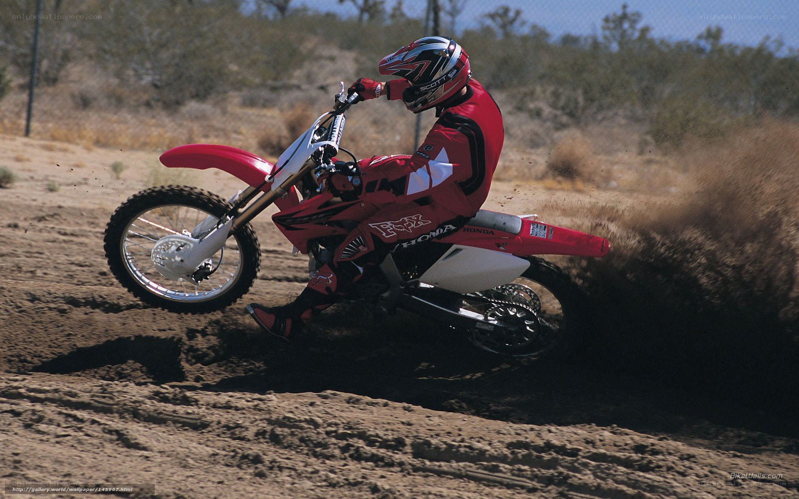 Motocross rider on dirt track